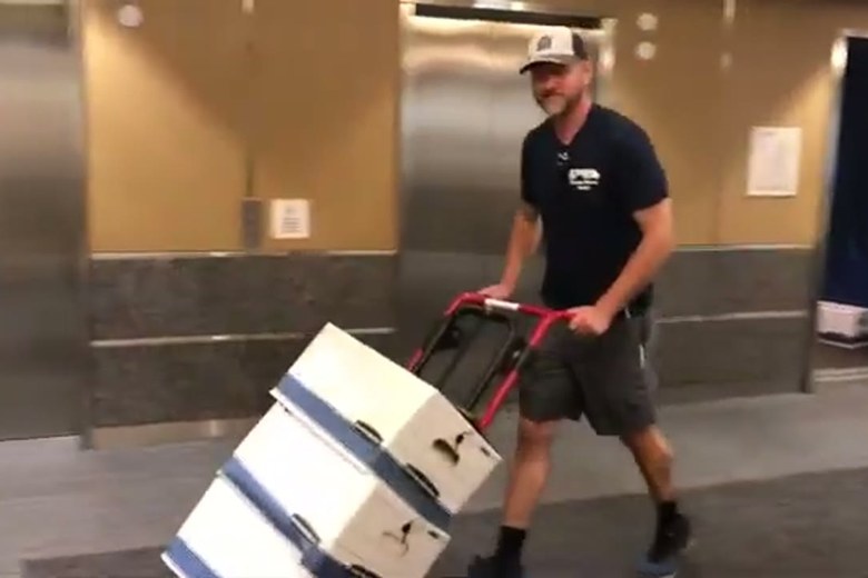 Wheeling boxes through the lobby